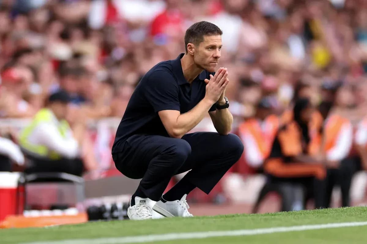 Coach crouching on sideline during match Coach crouching on sideline during match