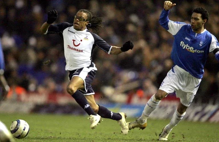 Player evading opponent during a football match Player evading opponent during a football match