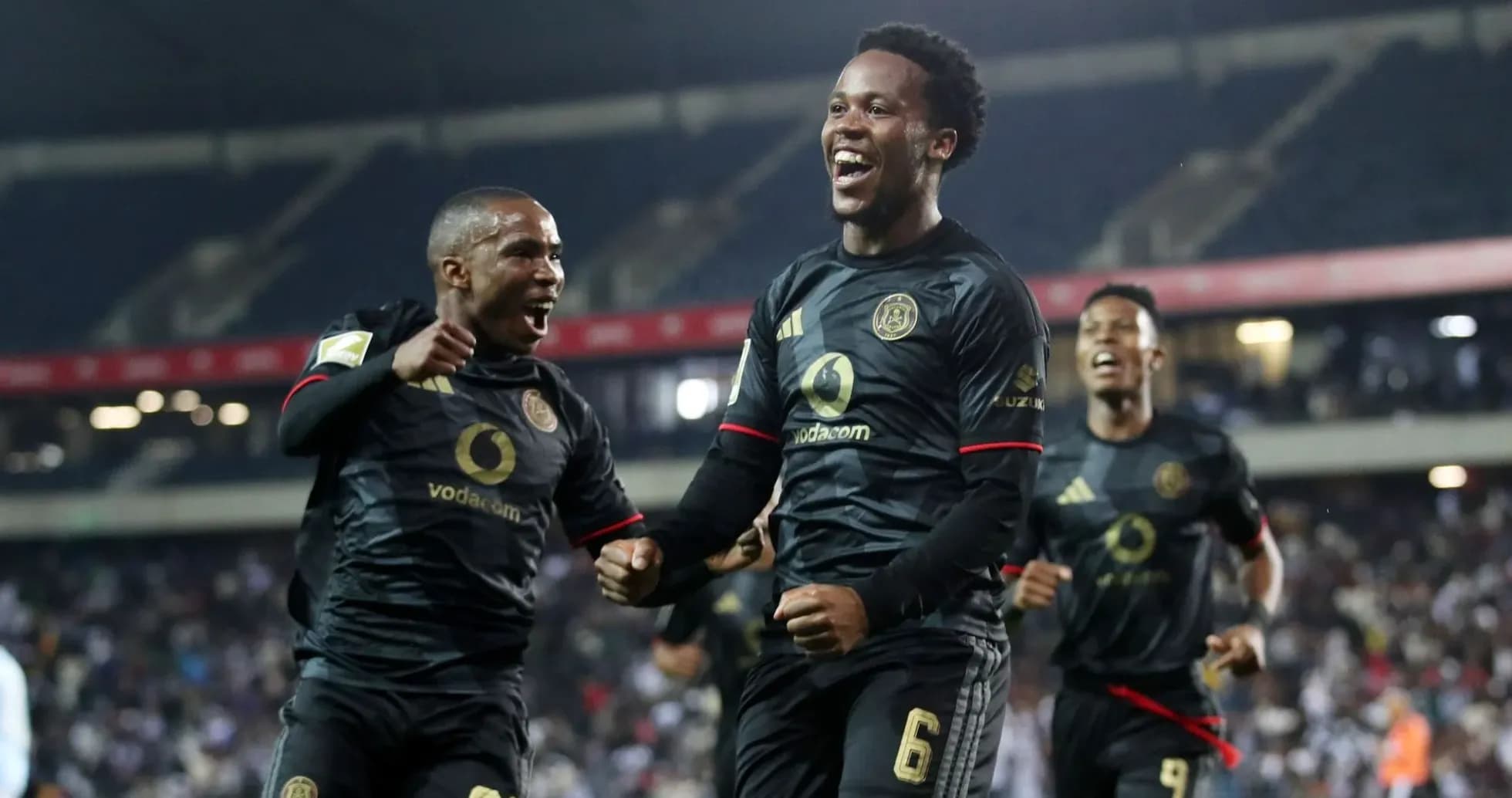 Players celebrating a goal during a football match Players celebrating a goal during a football match