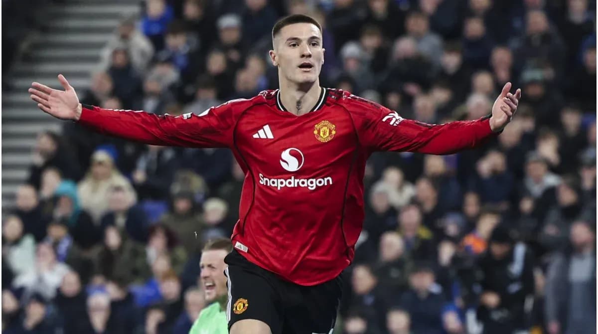 Player celebrating a goal in Manchester United jersey Player celebrating a goal in Manchester United jersey