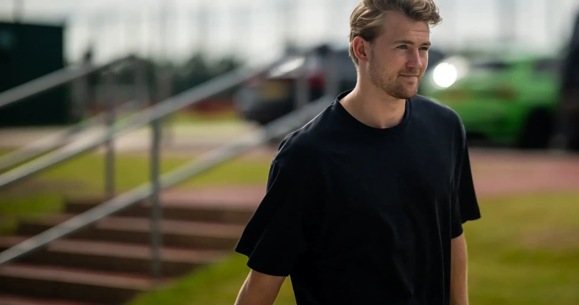 Player walking towards training facility in casual attire Player walking towards training facility in casual attire