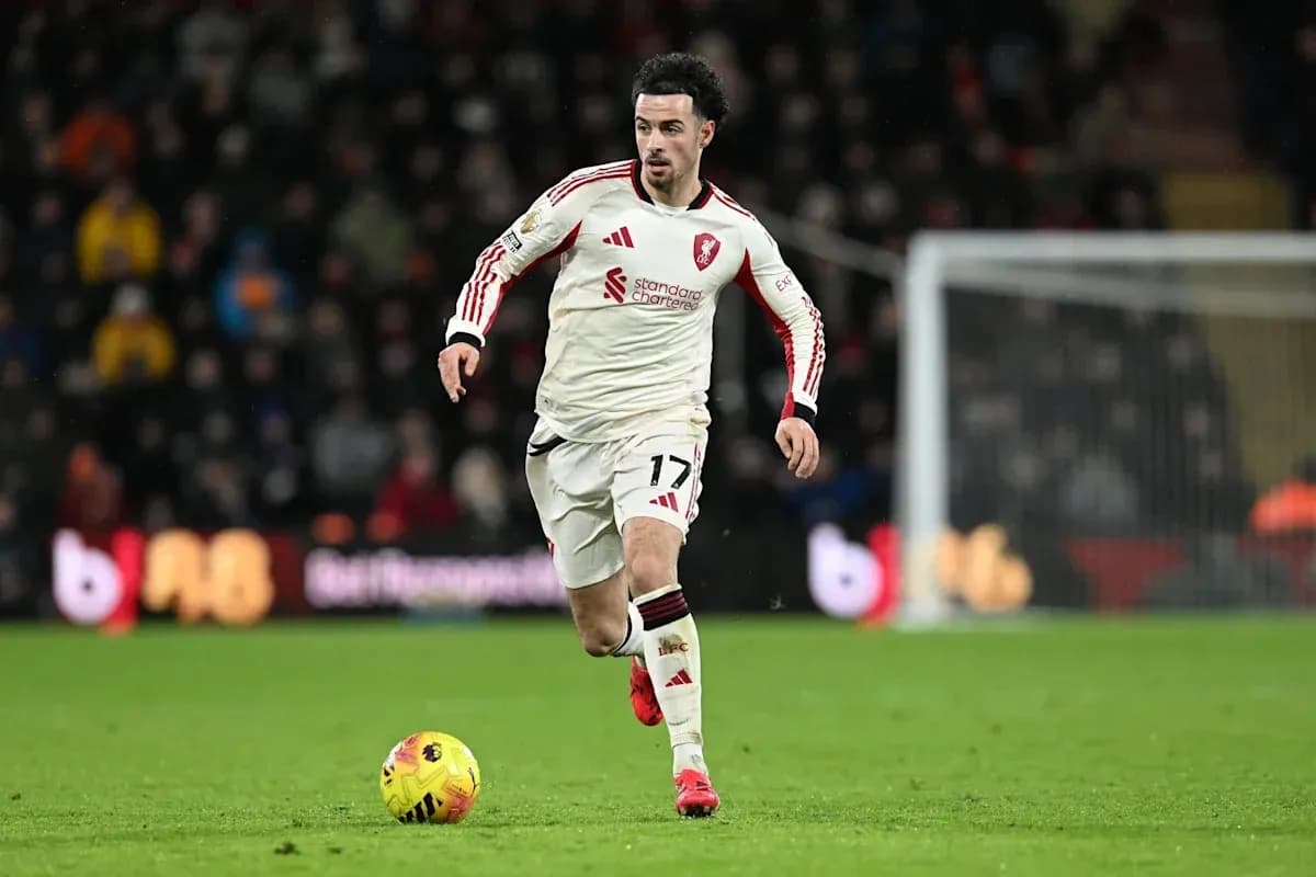 Player dribbling the ball during a football match Player dribbling the ball during a football match