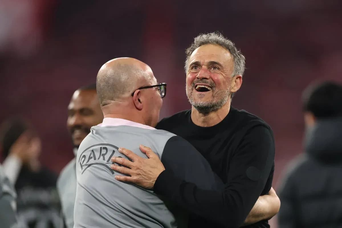 Coaches embracing after a successful match Coaches embracing after a successful match
