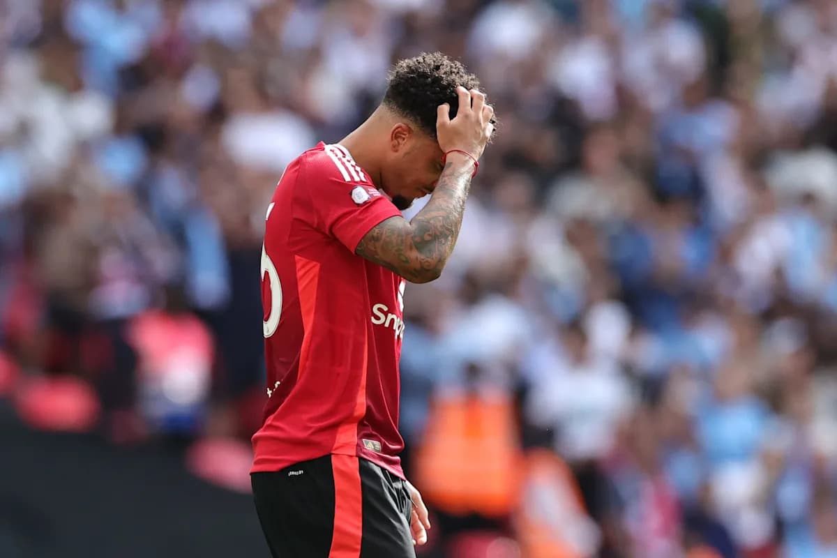 Player in red jersey holding head during match Player in red jersey holding head during match