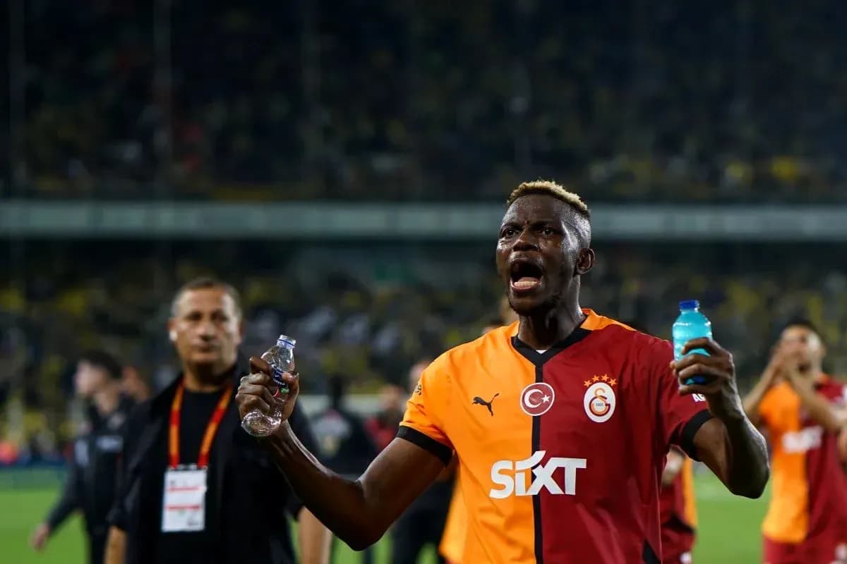 Player celebrating with water bottles after match Player celebrating with water bottles after match
