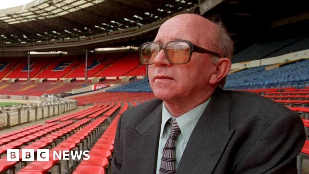 Man seated in empty stadium, looking ahead Man seated in empty stadium, looking ahead