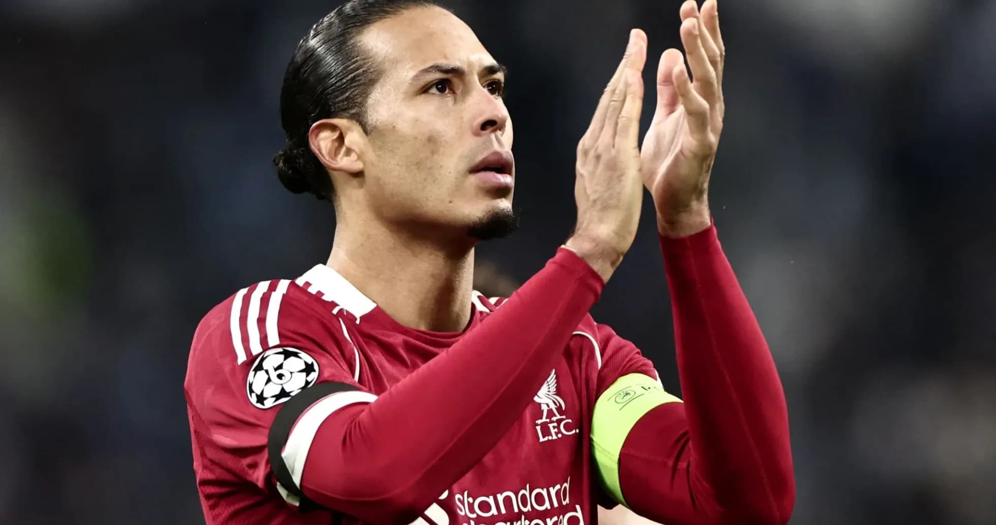 Player applauding fans in Liverpool jersey Player applauding fans in Liverpool jersey