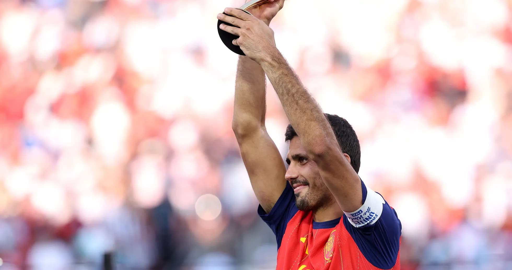 Player celebrating with trophy after match victory Player celebrating with trophy after match victory