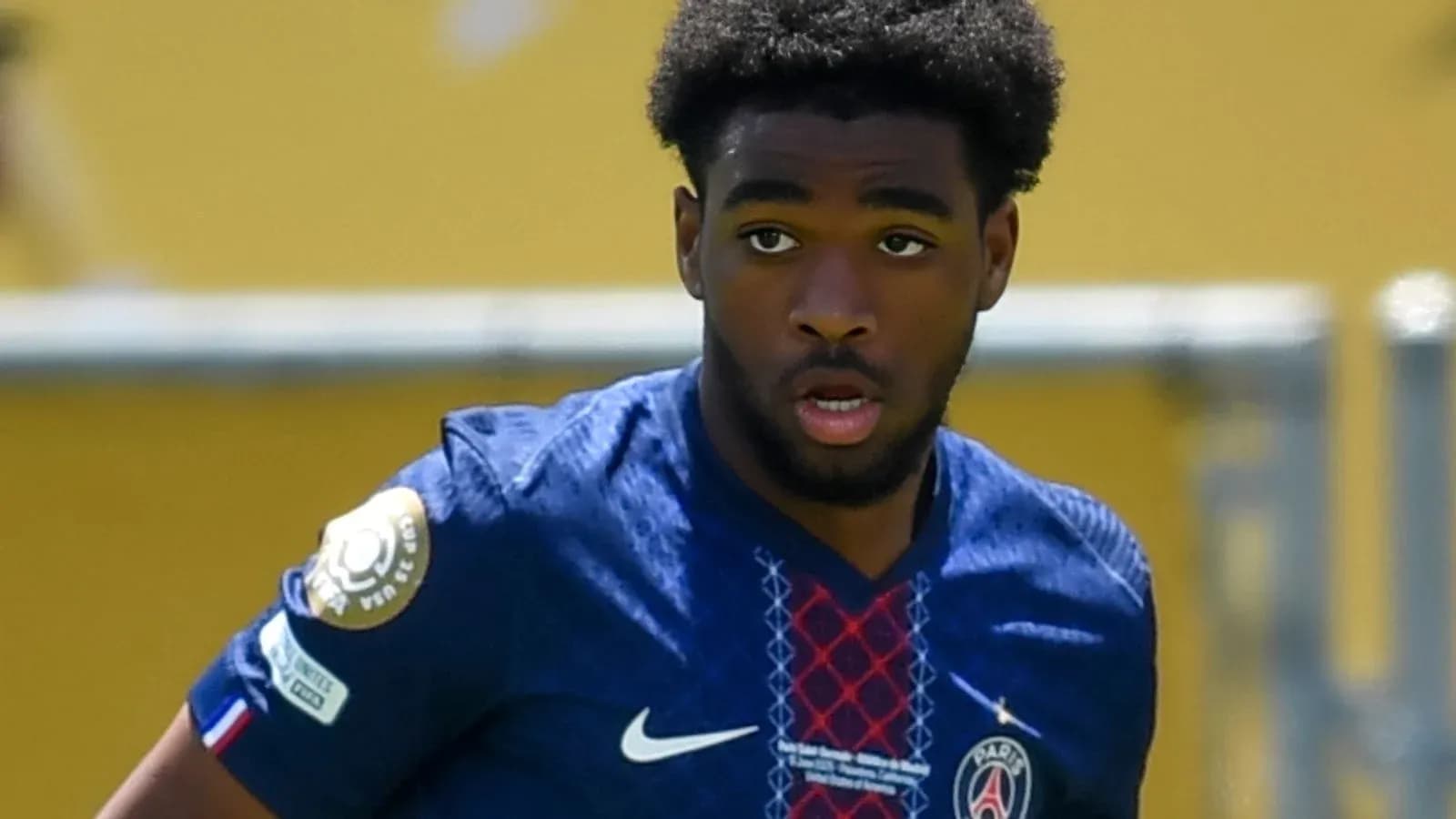 Player in Paris Saint-Germain jersey on the field Player in Paris Saint-Germain jersey on the field
