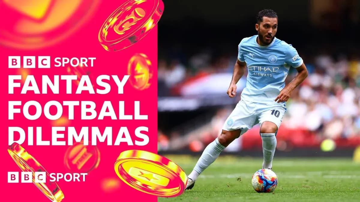Player in light blue kit dribbling the ball Player in light blue kit dribbling the ball