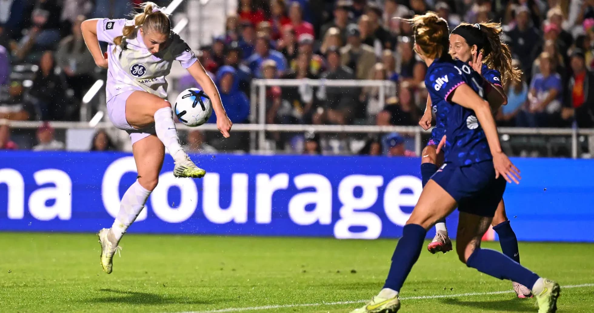 Player striking ball during NWSL match Player striking ball during NWSL match