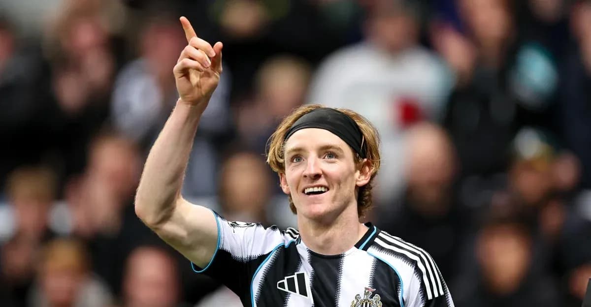 Newcastle player celebrating with raised finger Newcastle player celebrating with raised finger