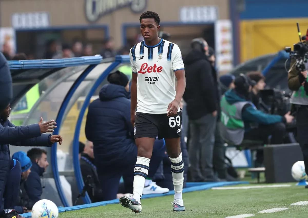 Player walking off the pitch towards the bench Player walking off the pitch towards the bench