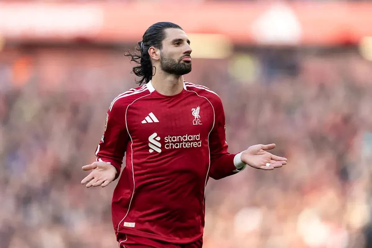 Liverpool player gesturing during a match Liverpool player gesturing during a match