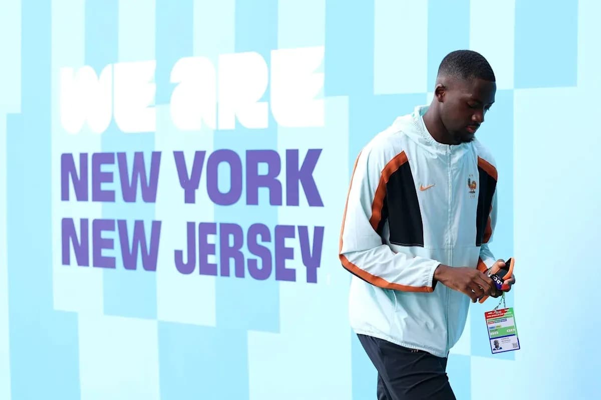 Player walking past 'We Are New York New Jersey' sign Player walking past 'We Are New York New Jersey' sign
