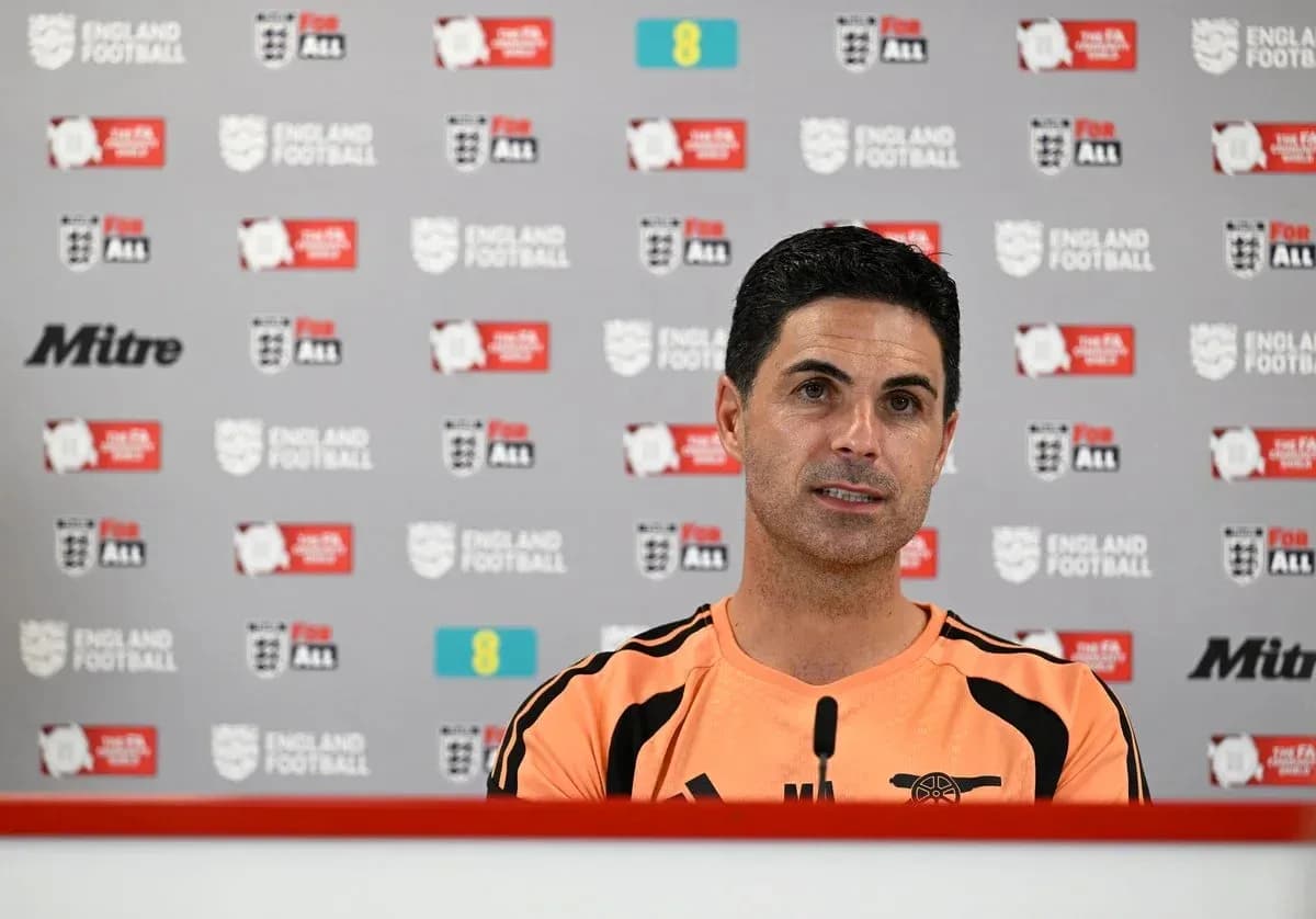 Manager speaking at press conference with logos backdrop Manager speaking at press conference with logos backdrop