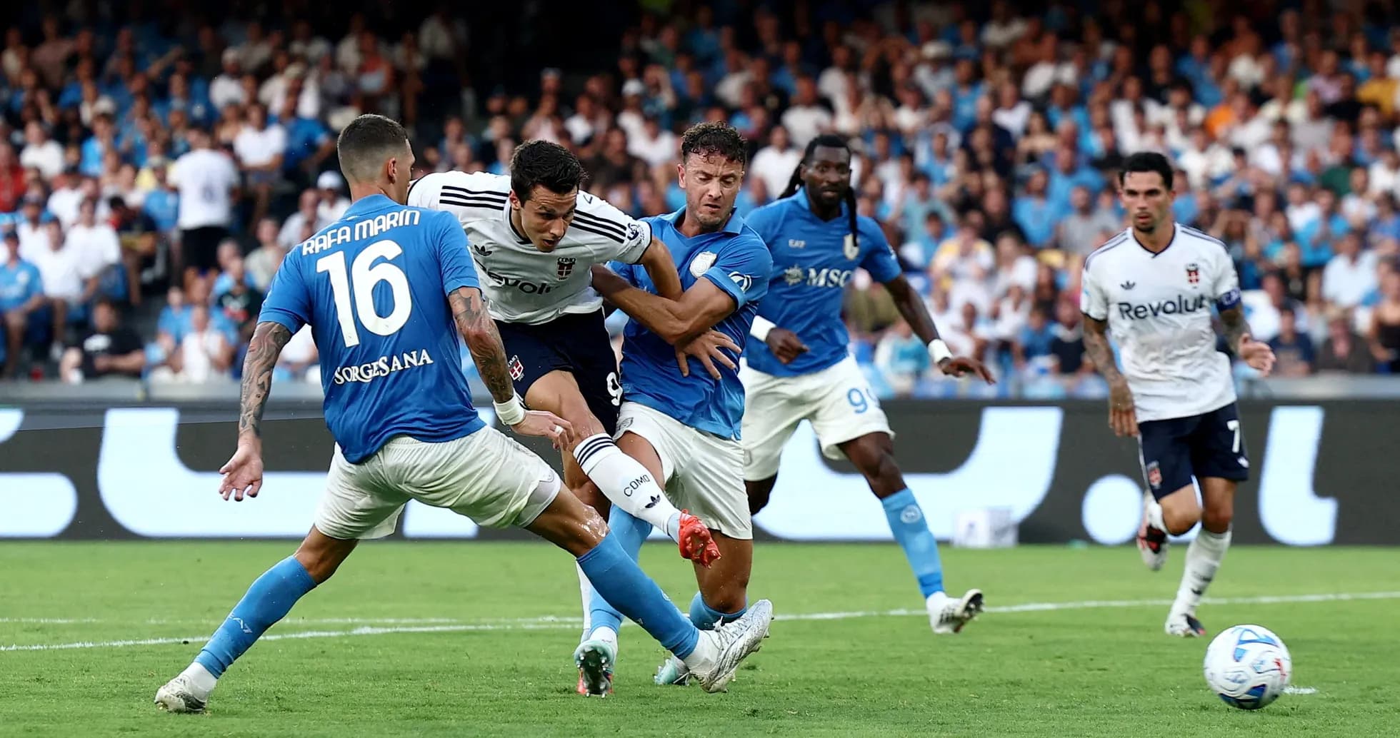 Players contesting for the ball in Serie A match Players contesting for the ball in Serie A match