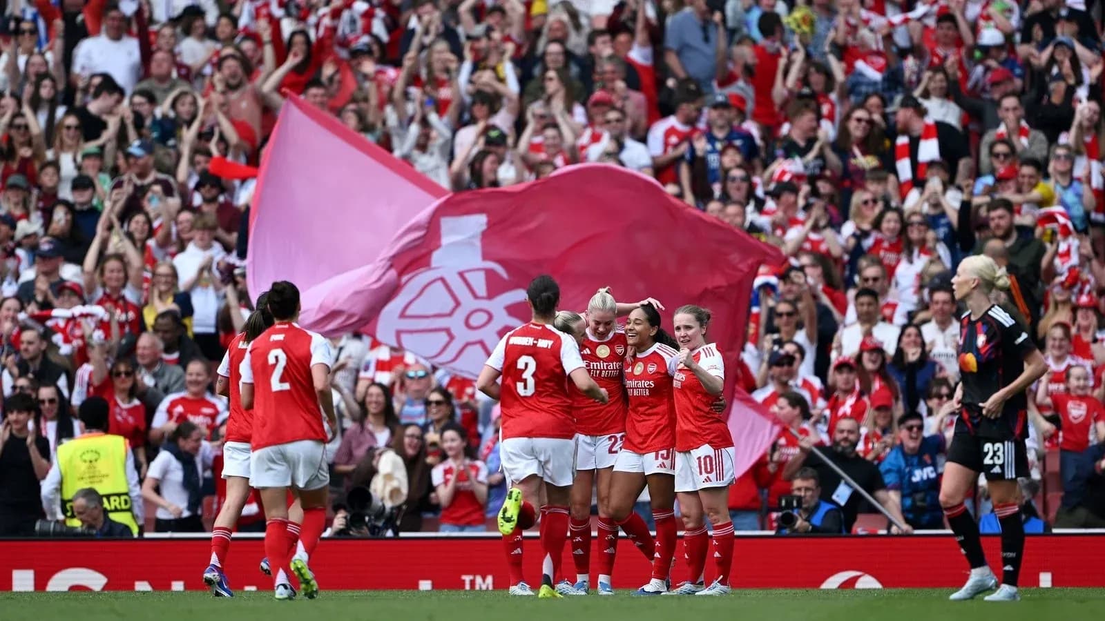 Arsenal players celebrating with fans at stadium Arsenal players celebrating with fans at stadium