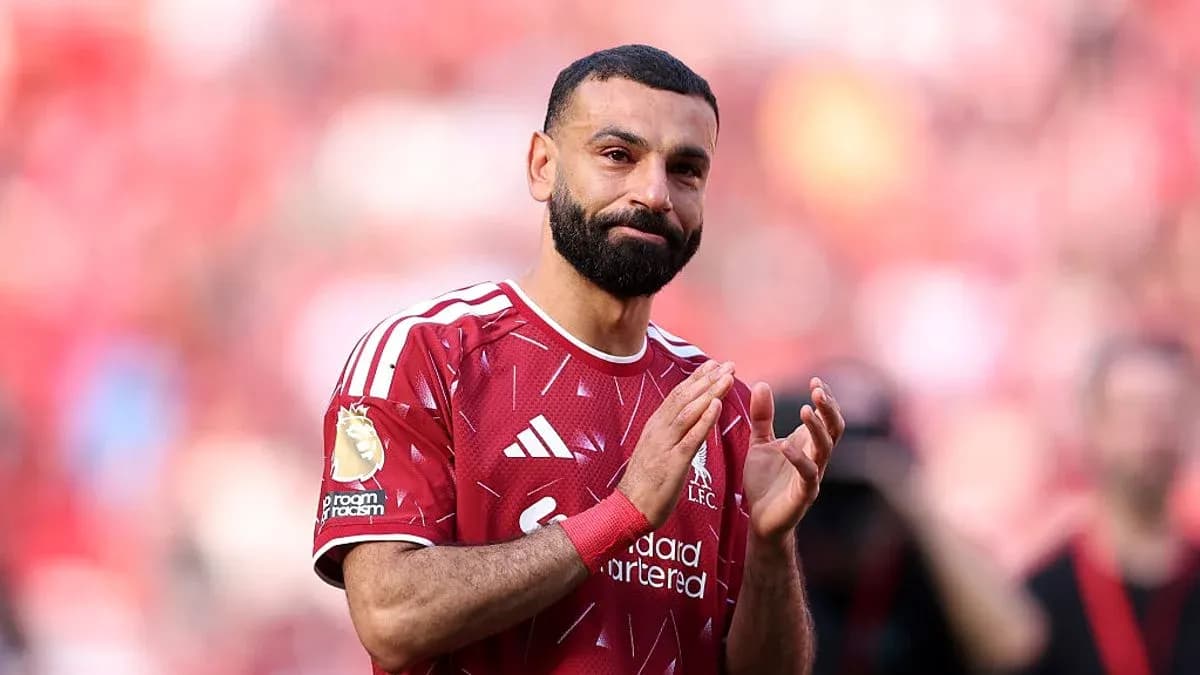 Player applauding fans in Liverpool jersey Player applauding fans in Liverpool jersey