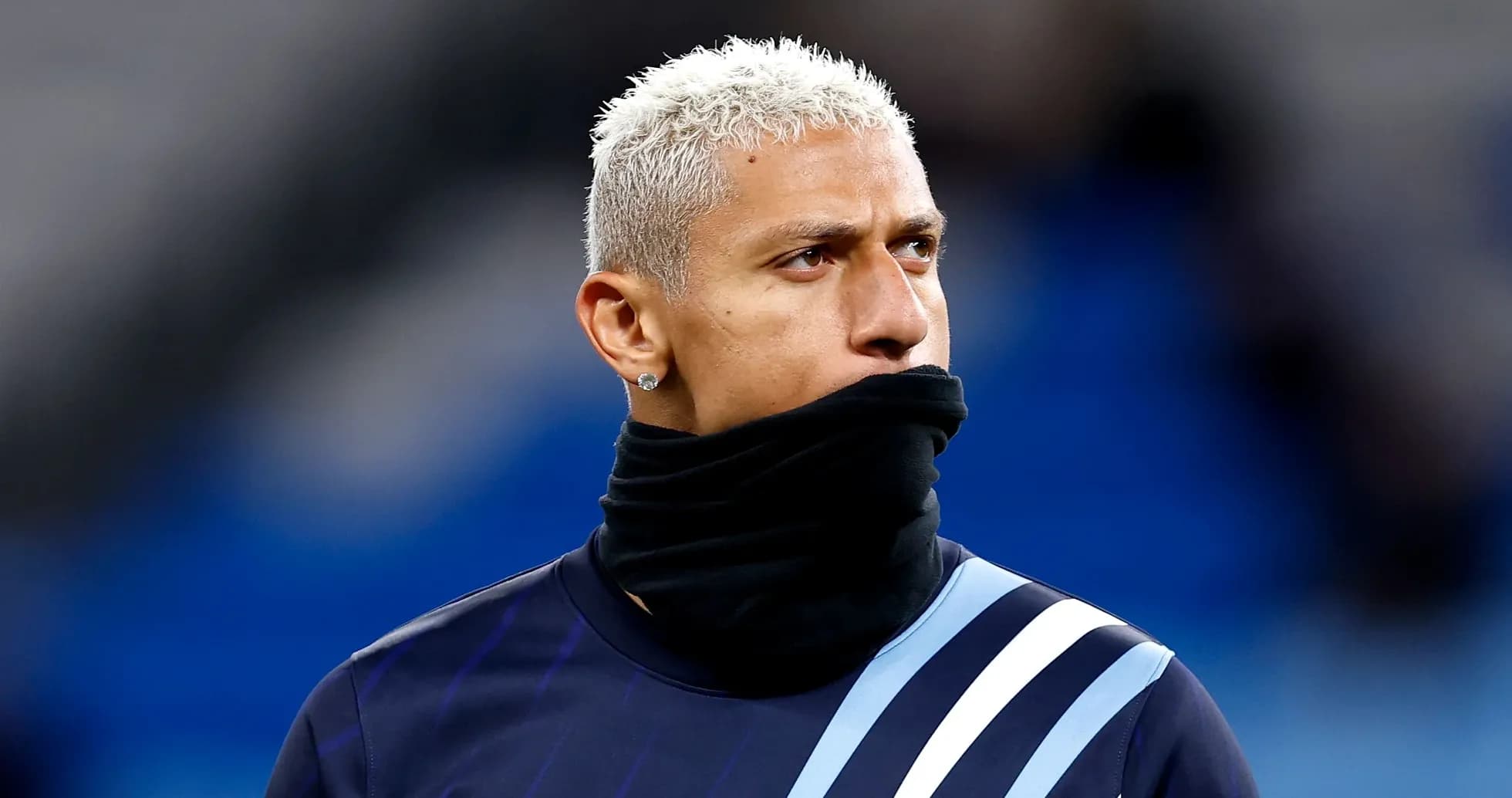 Player wearing a scarf during pre-match warm-up Player wearing a scarf during pre-match warm-up