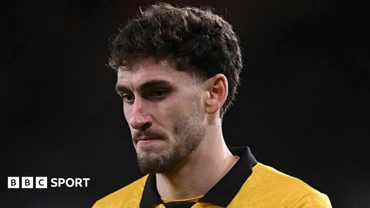 Player in yellow jersey during post-match moment Player in yellow jersey during post-match moment