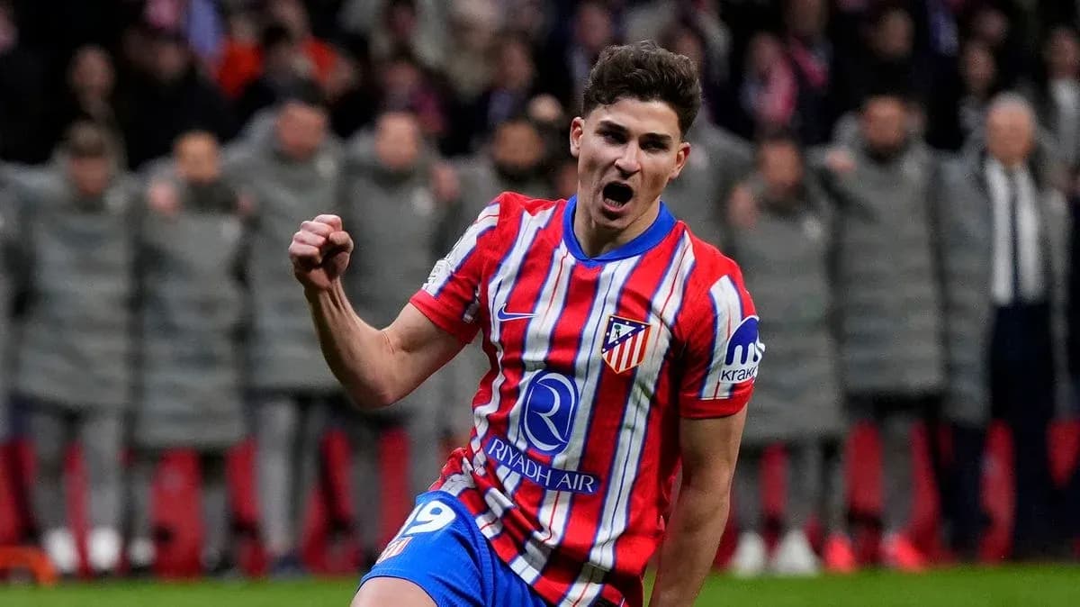 Atletico Madrid player celebrating a goal on field Atletico Madrid player celebrating a goal on field