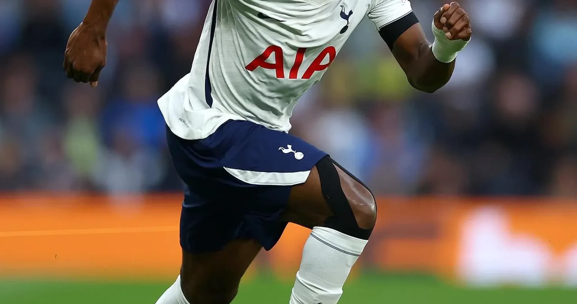 Player running with ball during a match Player running with ball during a match