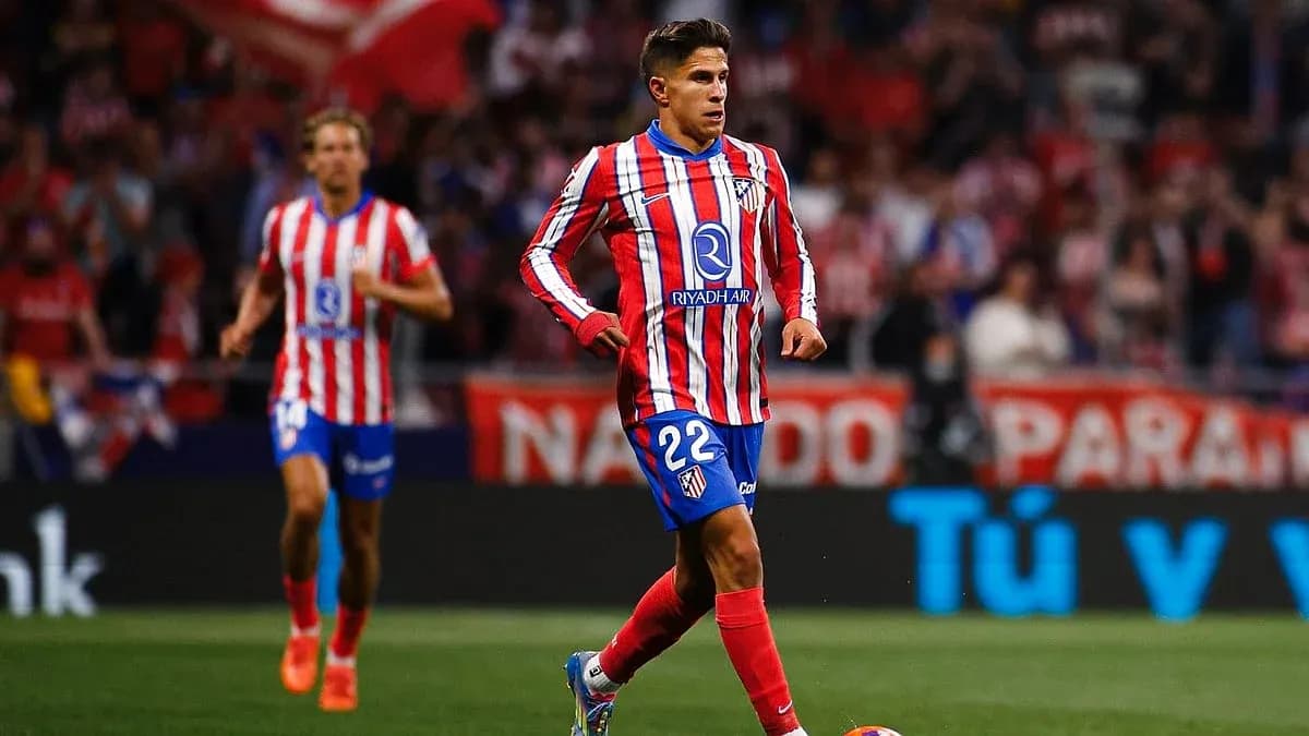 Atletico Madrid player running with the ball Atletico Madrid player running with the ball