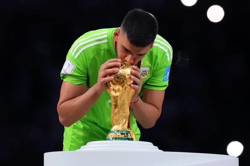 Goalkeeper kissing the FIFA World Cup trophy Goalkeeper kissing the FIFA World Cup trophy