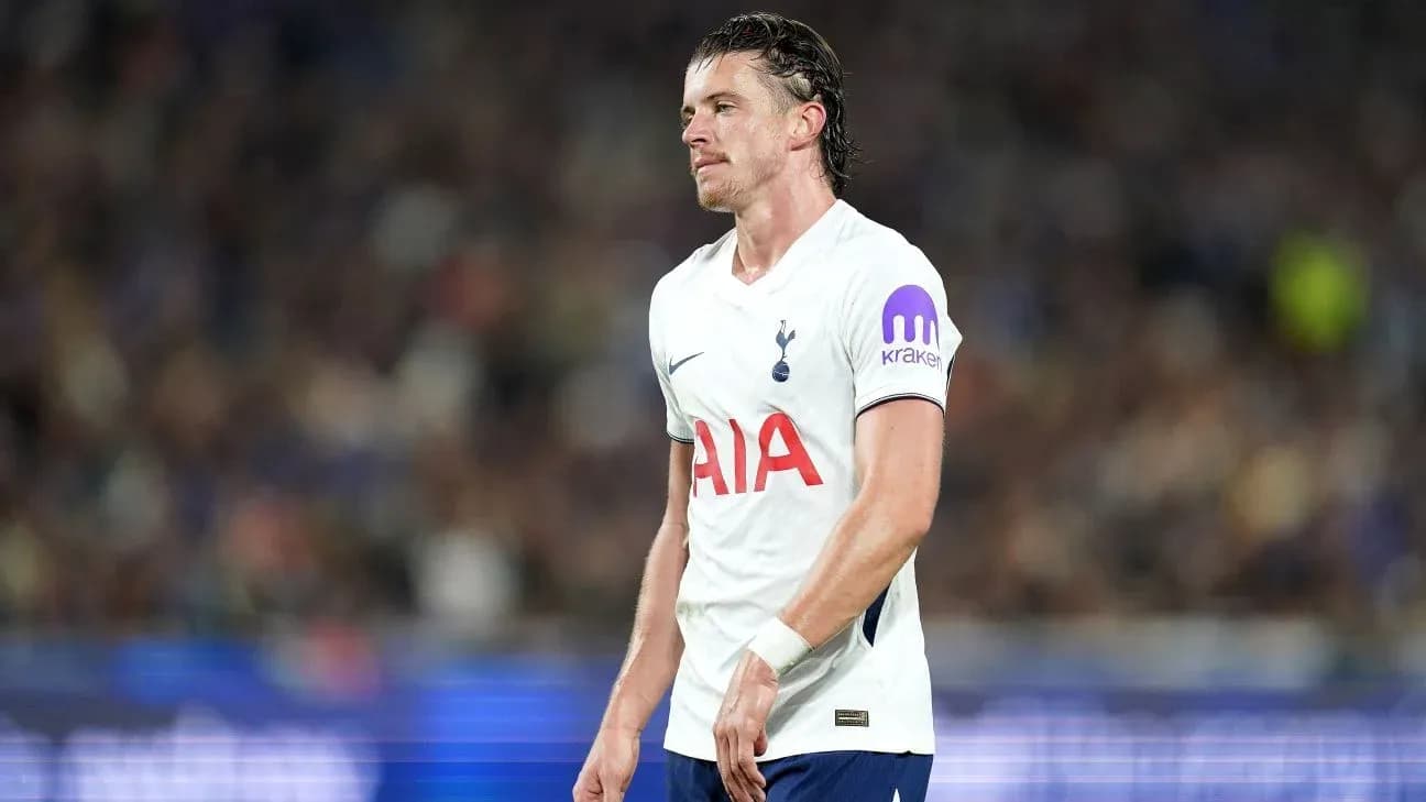 Tottenham player walking on pitch during match Tottenham player walking on pitch during match