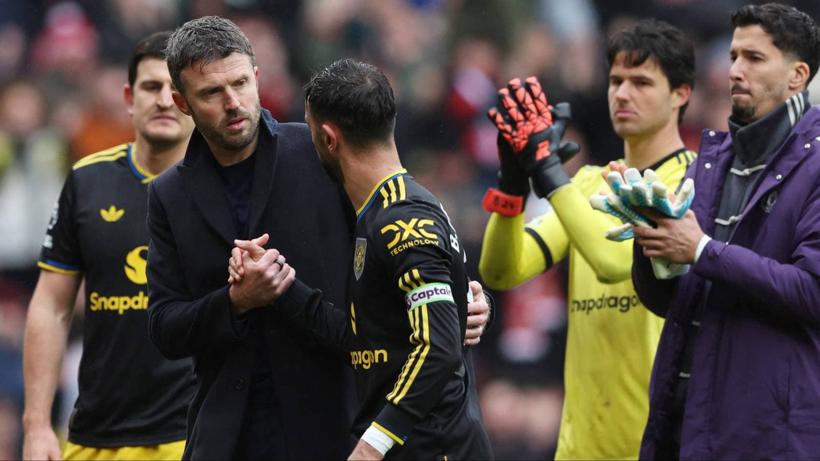 Manager congratulating player after match performance Manager congratulating player after match performance