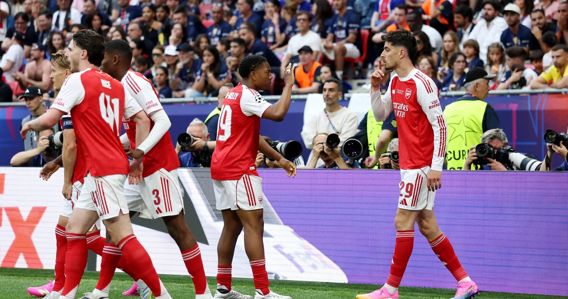Arsenal players celebrating during a match Arsenal players celebrating during a match