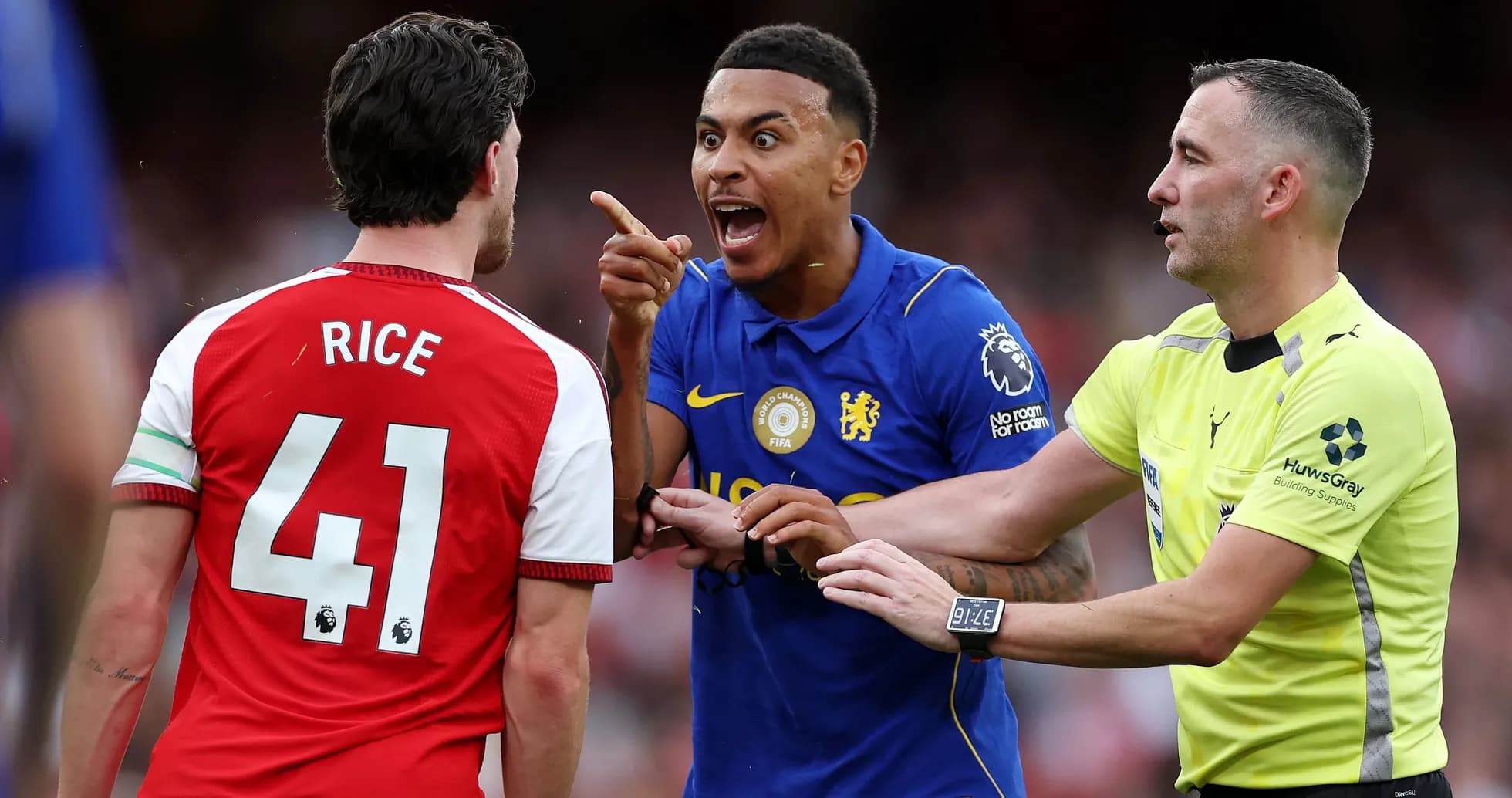 Players arguing during a match with referee intervening Players arguing during a match with referee intervening